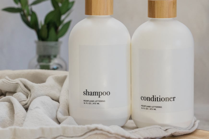 Shampoo and Conditioner Bottles on a Table